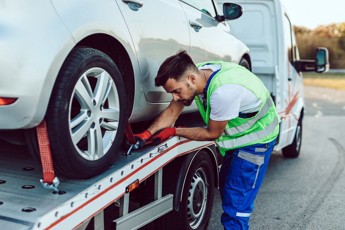 Roadside assistance worker helping driver